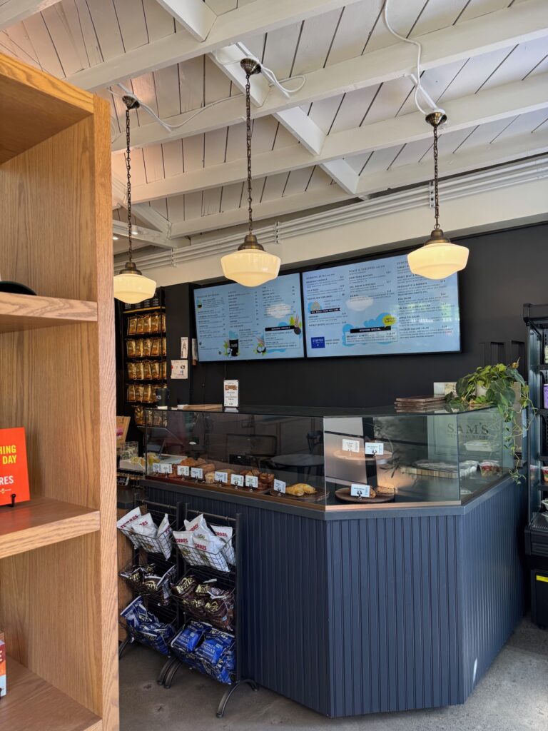 interior counter view of Sam's General store with counter of bake goods.