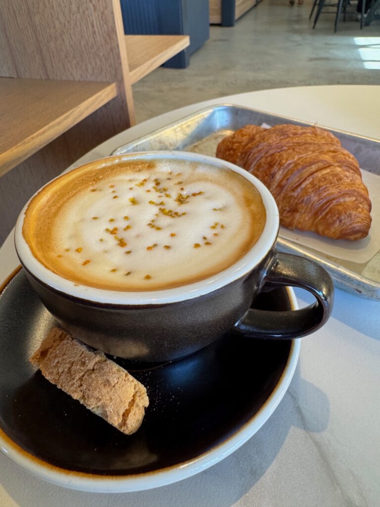 picture of cappuccino with butter croissant.